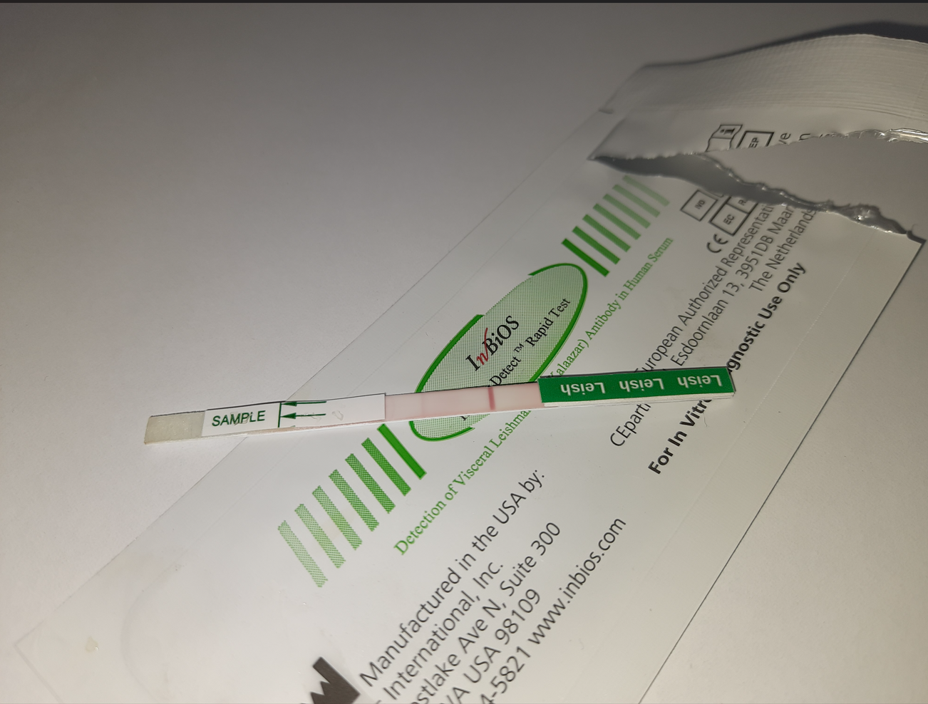 An InBiOS Detect rapid diagnostic test for Visceral Leishmaniasis (Kala-azar) that appears to show two visible lines, which is consistent with a positive antibody result
