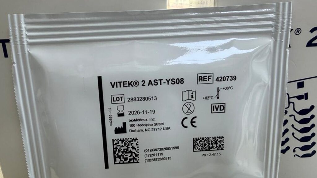 This image shows a sealed foil package for a VITEK 2 AST-YS08 card, which is used for the automated antimicrobial susceptibility testing (AST) of yeast.