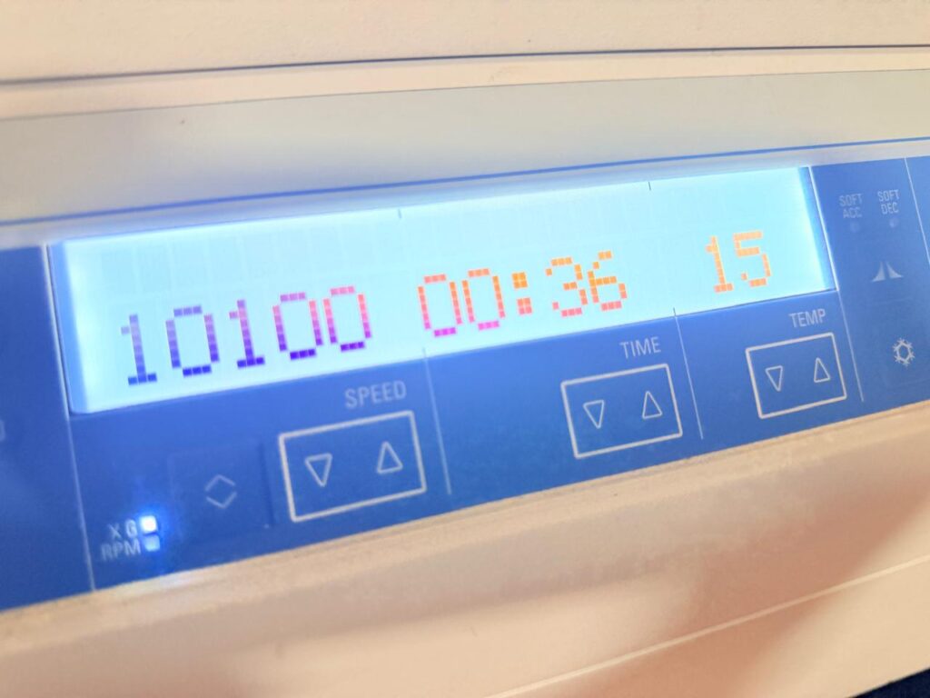 Centrifuging the tubes at ≥ 10,000 x g for 1 minute-